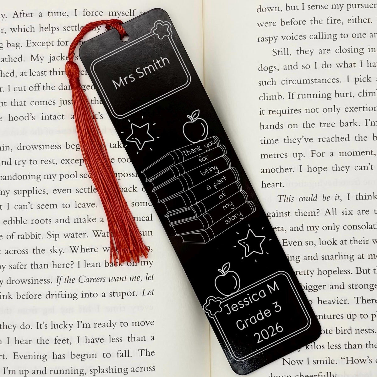     Black Personalised Teacher Gift Metal Bookmark with custom names and thank you message displayed inside an open book