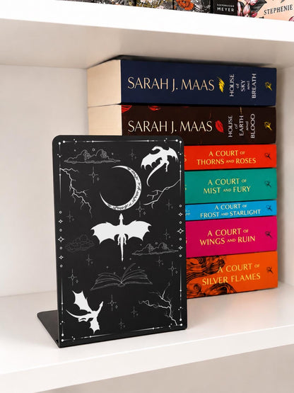     Fantasy Dragons Metal Bookshelf Bookends featuring engraved dragons and celestial artwork displayed with fantasy books