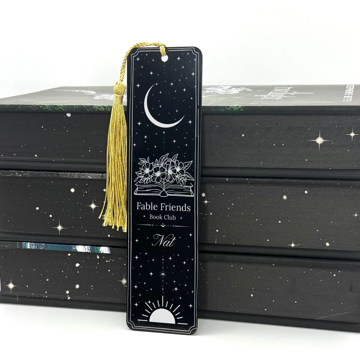     Personalised Bookclub Metal Bookmark in black with personalised book club and member name, moon, stars, floral book design and gold tassel