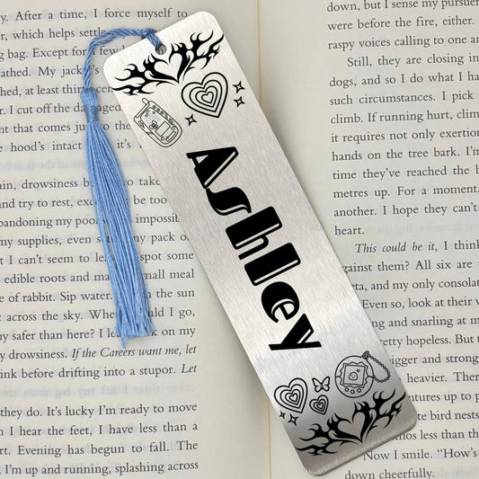     Personalised Name Retro Vibe Metal Bookmark in brushed silver featuring a custom name, retro-inspired designs and a blue tassel.