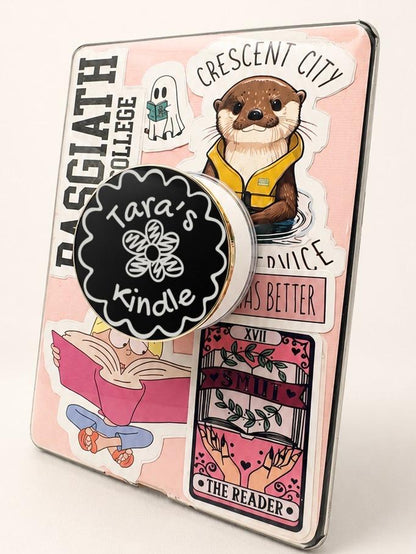 Personalised Name Floral Metal E-Reader Grip on a decorated Kindle with stickers.