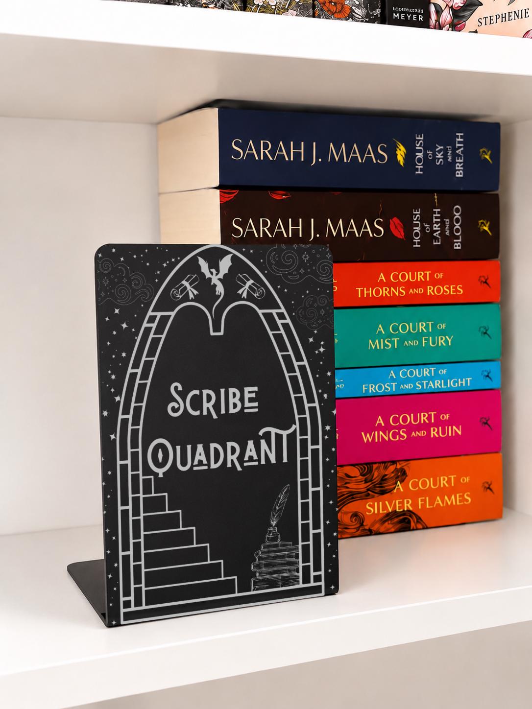     Scribe Quadrant Metal Bookshelf Bookends with black metal finish displayed beside fantasy book collection