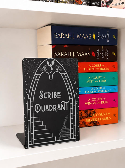     Scribe Quadrant Metal Bookshelf Bookends with black metal finish displayed beside fantasy book collection