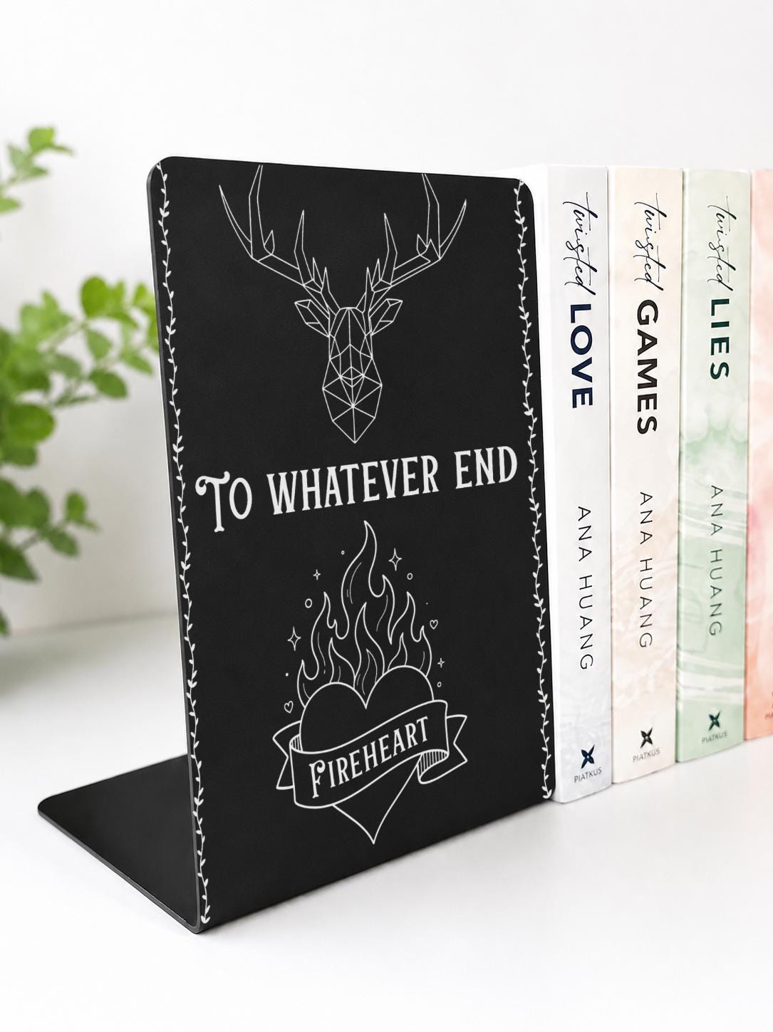     To Whatever End Metal Bookshelf Bookends in black metal with engraved stag, Fireheart and decorative vine design