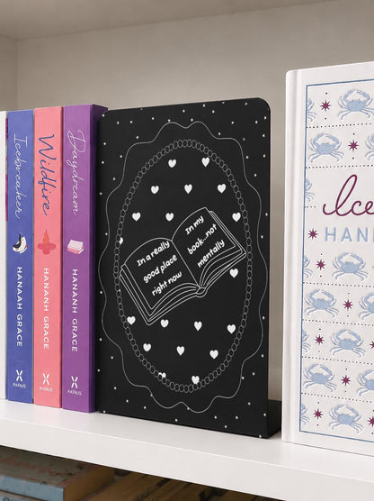     In A Good Place In My Book Metal Bookshelf Bookends featuring an open book, heart and star design on a bookshelf