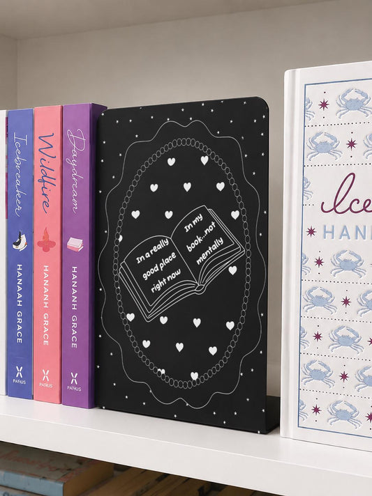     In A Good Place In My Book Metal Bookshelf Bookends featuring an open book, heart and star design on a bookshelf