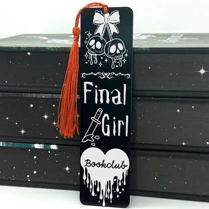     Final Girl Slasher Genre Metal Bookmark in black featuring skulls, bow, knife and dripping heart design with red tassel.