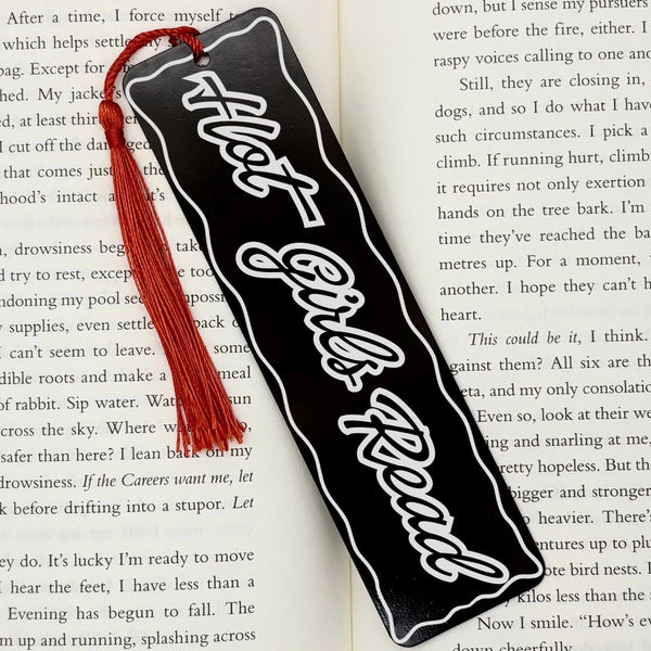 Hot Girls Read Metal Engraved Bookmark featuring a black design and red tassel, perfect for book lovers.
