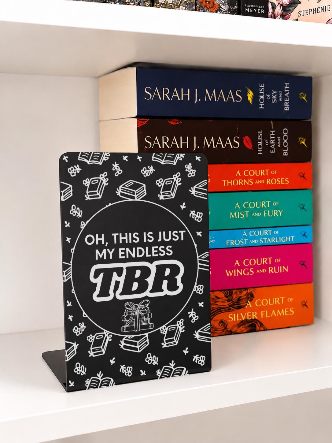     Endless TBR Quote Bookshelf Sign Bookends in black metal featuring “Oh, This Is Just My Endless TBR” with engraved book illustrations.