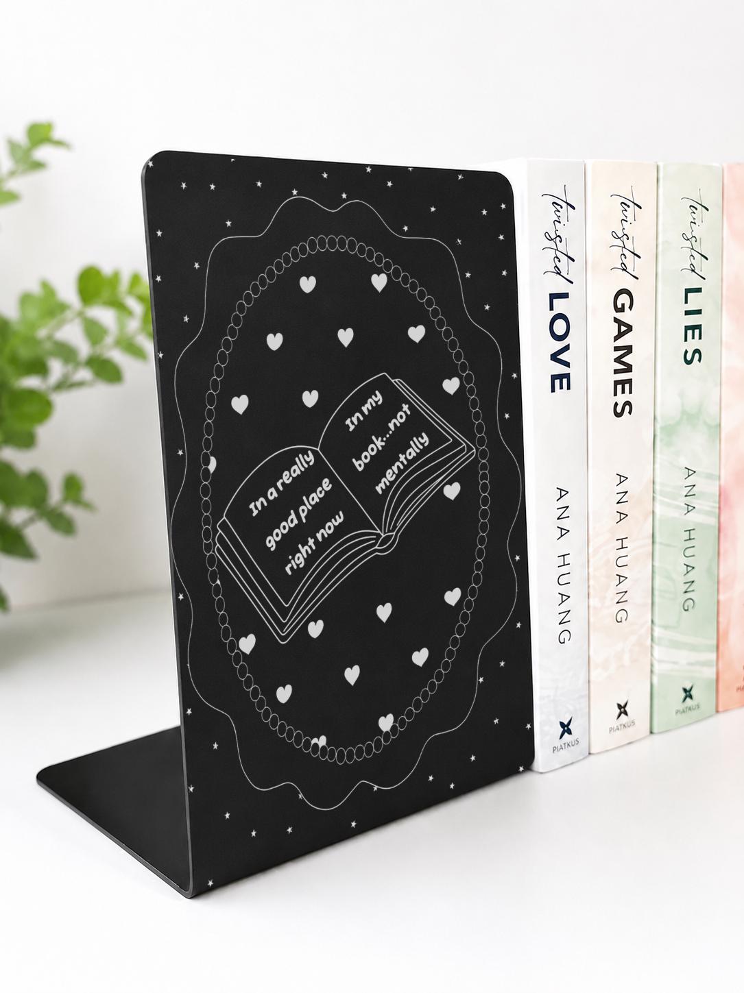     In A Good Place In My Book Metal Bookshelf Bookends in black metal with engraved open book, hearts and celestial design