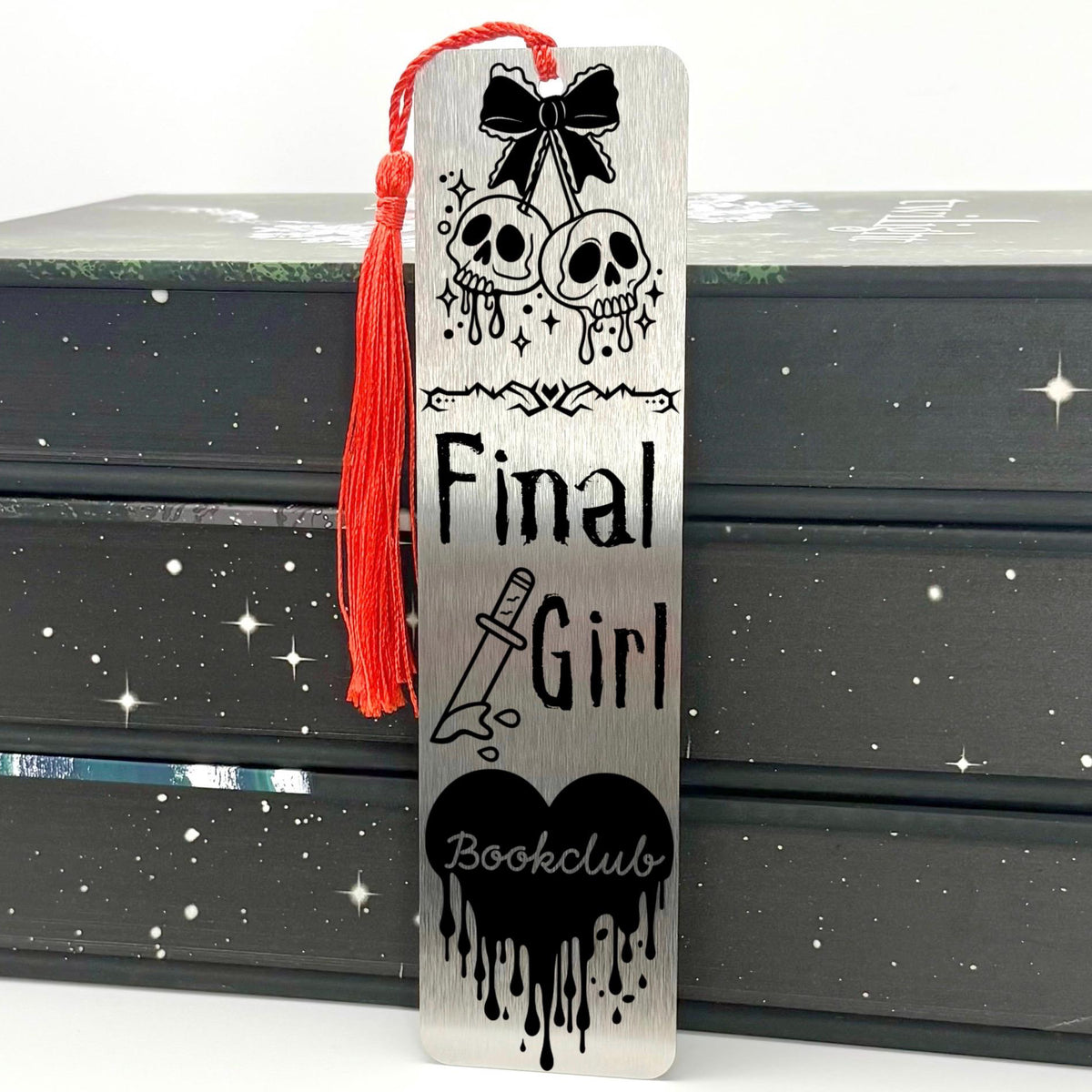     Final Girl Slasher Genre Metal Bookmark in brushed silver with engraved skull, knife and dripping heart artwork.