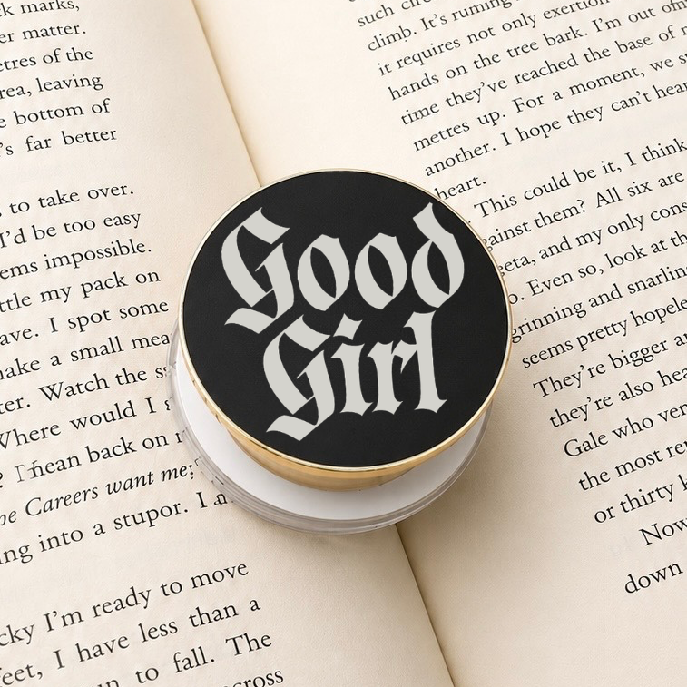     Good Girl Metal MagSafe Kindle Grip featuring gothic lettering displayed on an open book