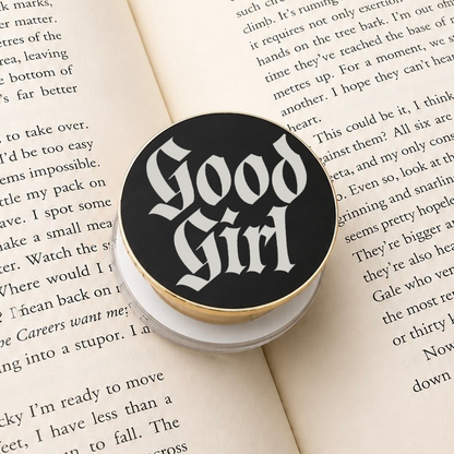     Good Girl Metal MagSafe Kindle Grip featuring gothic lettering displayed on an open book