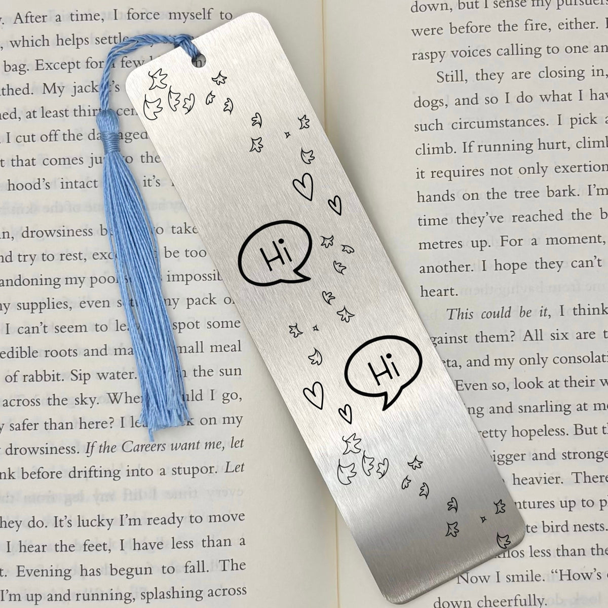     Silver Bookish Gay Romance Metal Bookmark displayed on an open book with engraved romance design