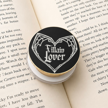 Villain Lover Metal MagSafe Kindle Grip featuring gothic lettering displayed on an open book