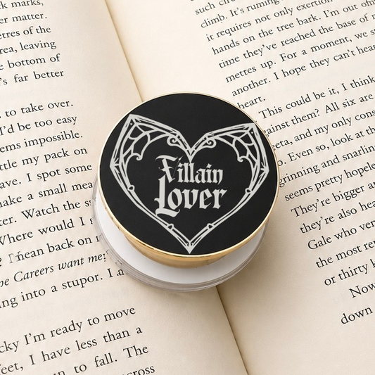 Villain Lover Metal MagSafe Kindle Grip featuring gothic lettering displayed on an open book