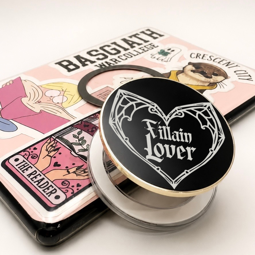     Villain Lover Metal MagSafe Kindle Grip with black gothic design displayed beside a Kindle