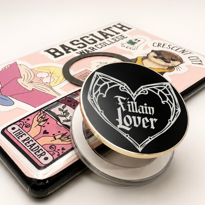     Villain Lover Metal MagSafe Kindle Grip with black gothic design displayed beside a Kindle