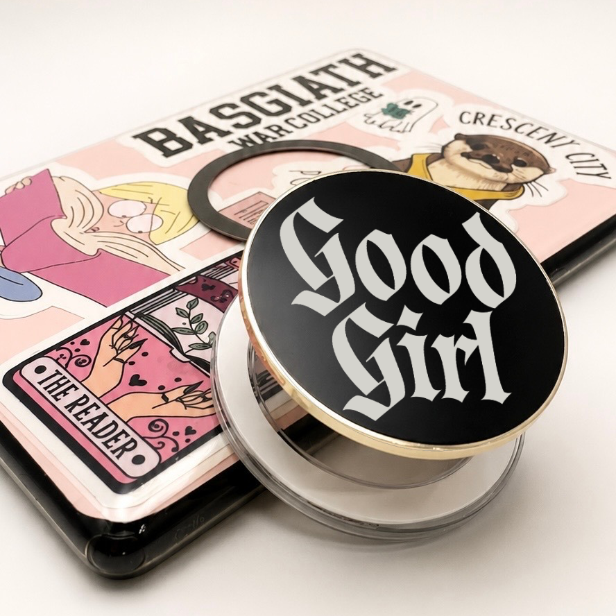     Good Girl Metal MagSafe Kindle Grip with black gothic design displayed beside a Kindle