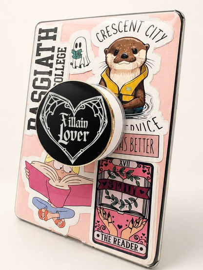     Villain Lover Metal MagSafe Kindle Grip attached to a pink sticker-covered Kindle for book lovers
