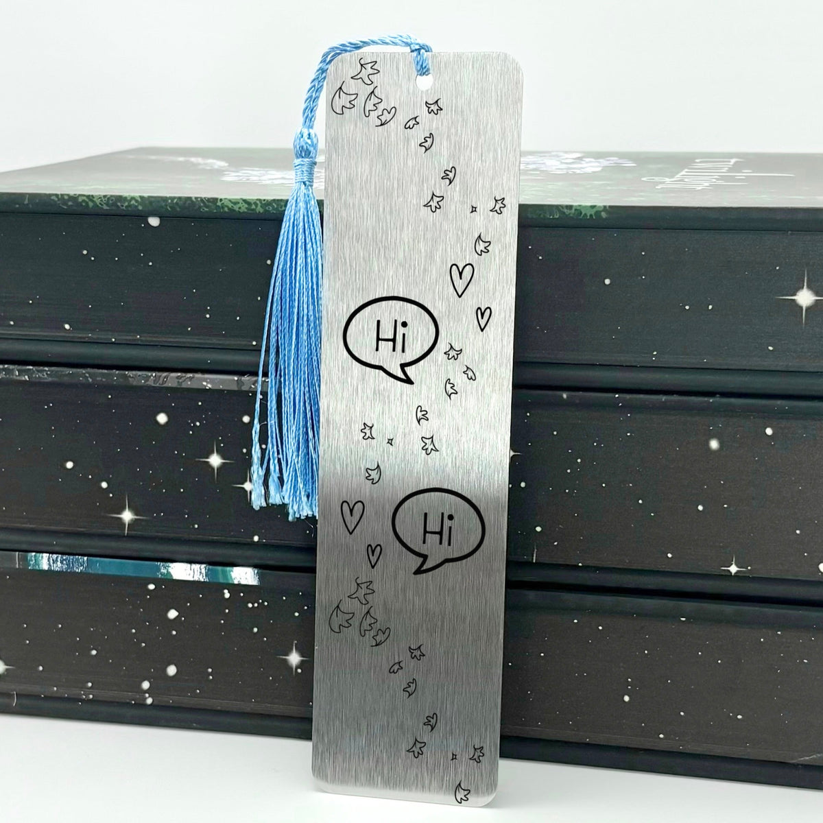     Silver Bookish Gay Romance Metal Bookmark with speech bubbles, hearts and blue tassel