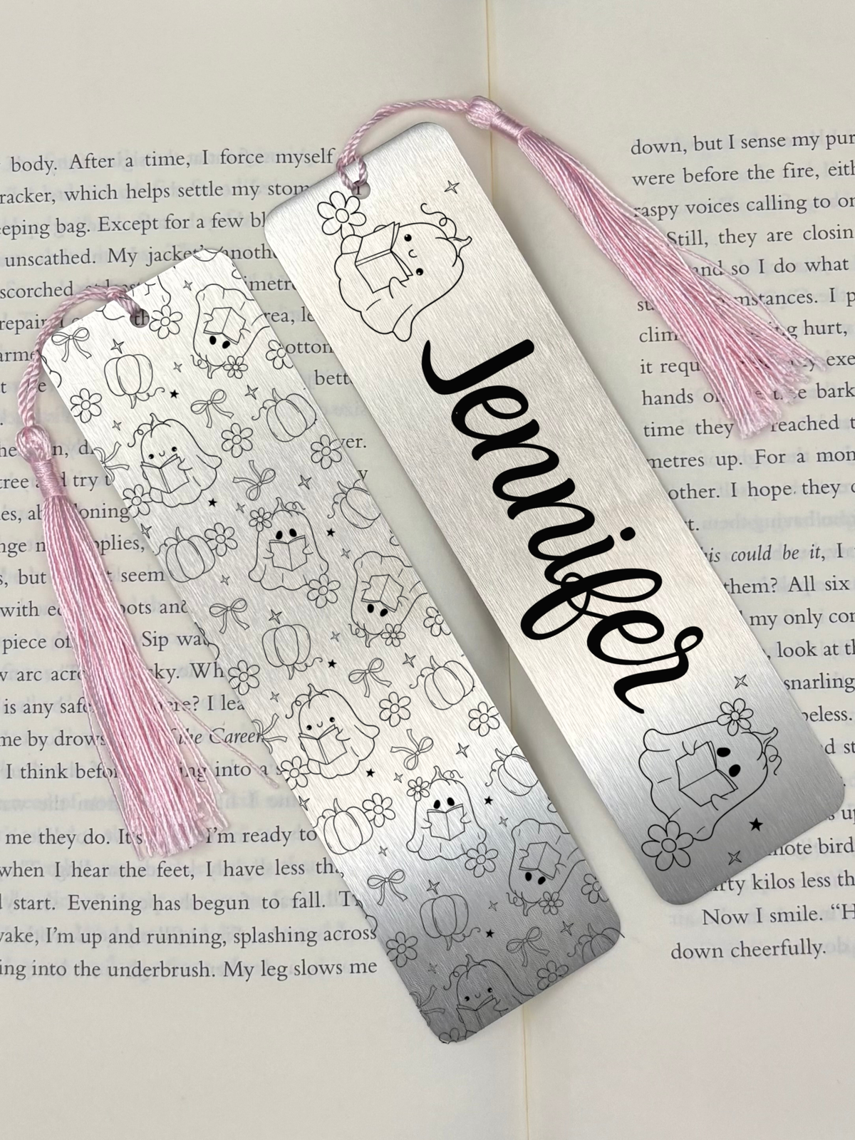 Personalised Spooky Season Metal Bookmark featuring a cute ghost design and the name Jennifer on it.