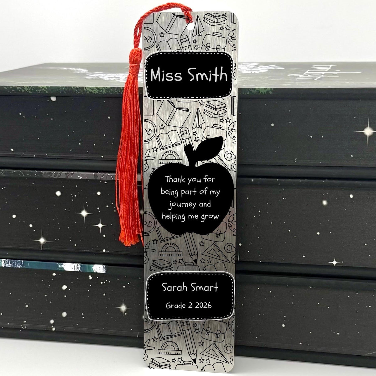     Personalised Teacher Gift Bookmark in brushed silver with teacher name, apple design, student name and red tassel