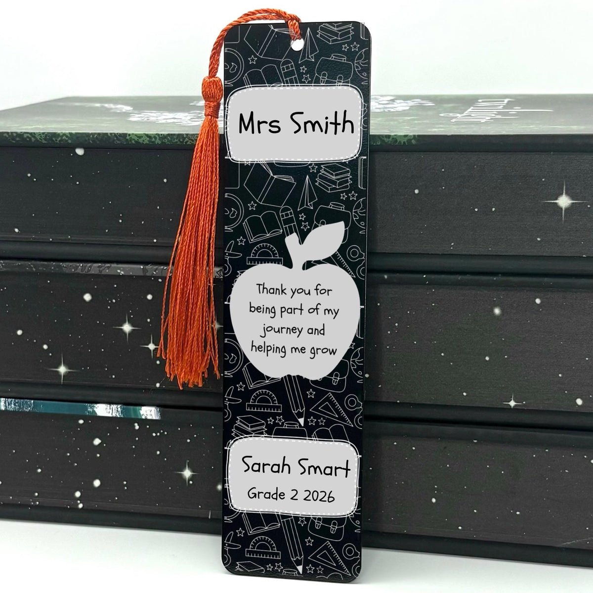     Personalised Teacher Gift Bookmark in black with personalised teacher and student names, apple design and red tassel