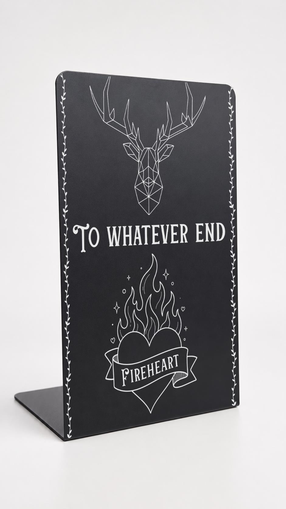     To Whatever End Metal Bookshelf Bookends in black with geometric stag, flaming heart and Fireheart design