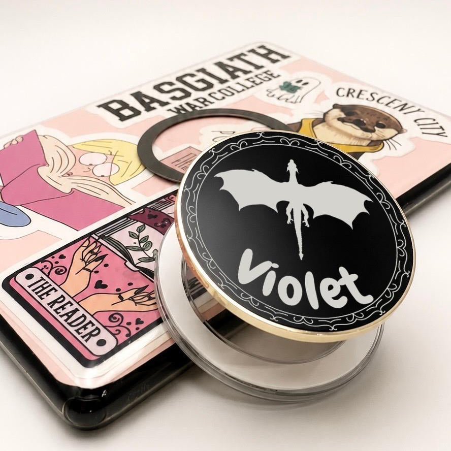     Personalised Name Dragon Metal E-Reader Grip with Violet custom name and dragon design, shown close-up on an e-reader.