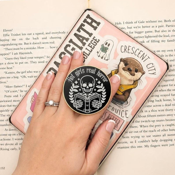     Hot Girls Read Horror Metal Kindle MagSafe Grip shown in use while holding a decorated Kindle e-reader